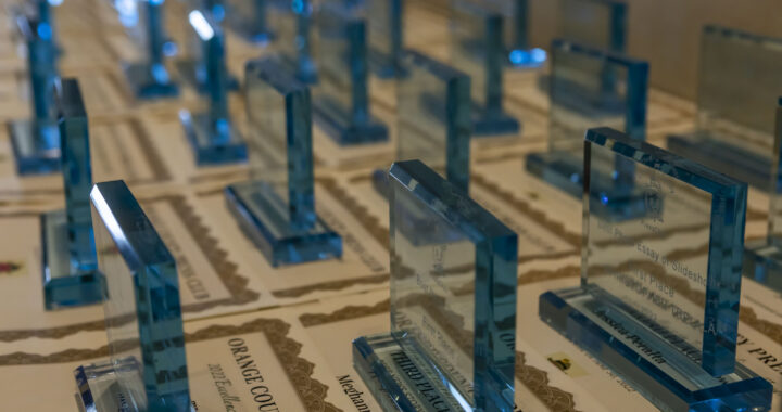 Glass awards arranged over certificates
